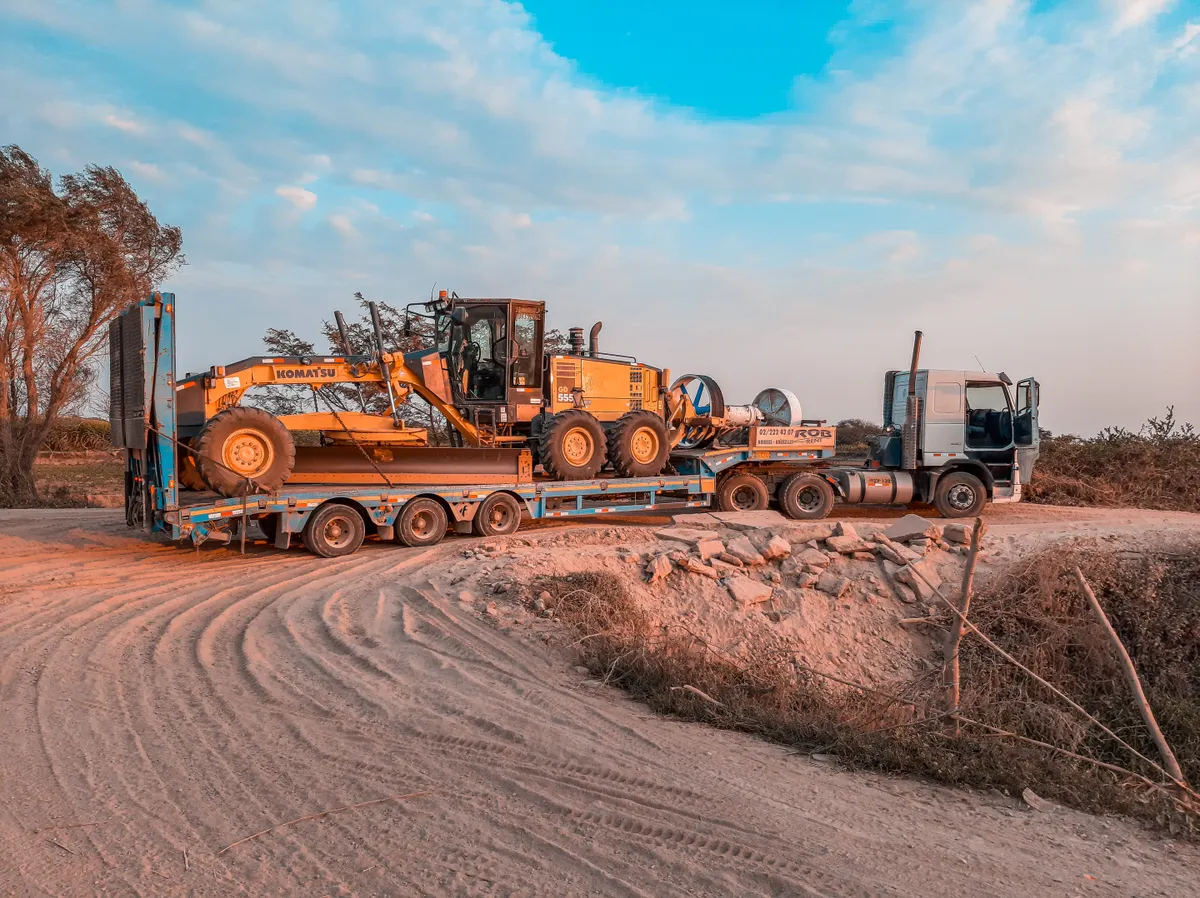 Stock photo: Heavy machinery transported on a low-loader truck